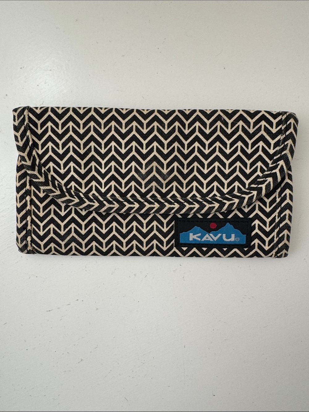 KAVU cream and black geometric patterned canvas wallet.